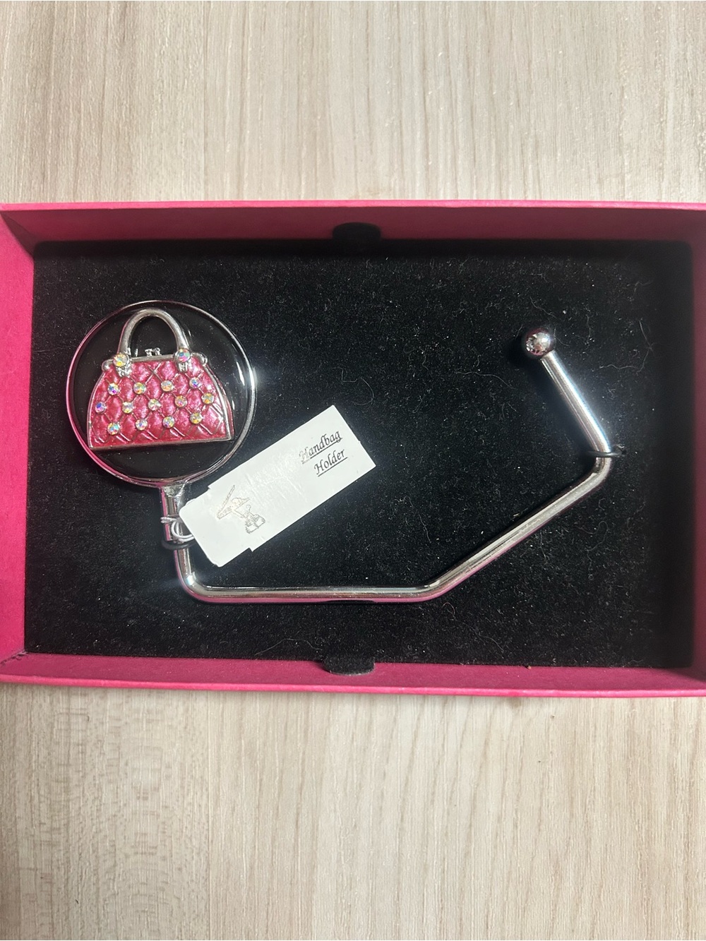 $5 in a bundle Spring Street handbag holder featuring a pink, rhinestone-embelli